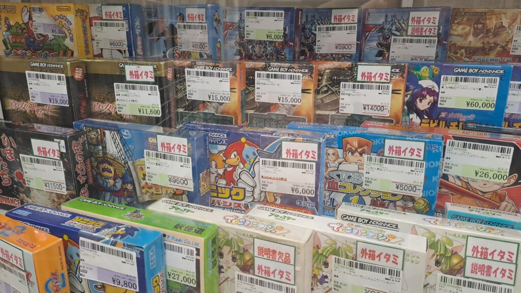 Boxed GBA games behind a display in Suruga-ya, Den-Den Town