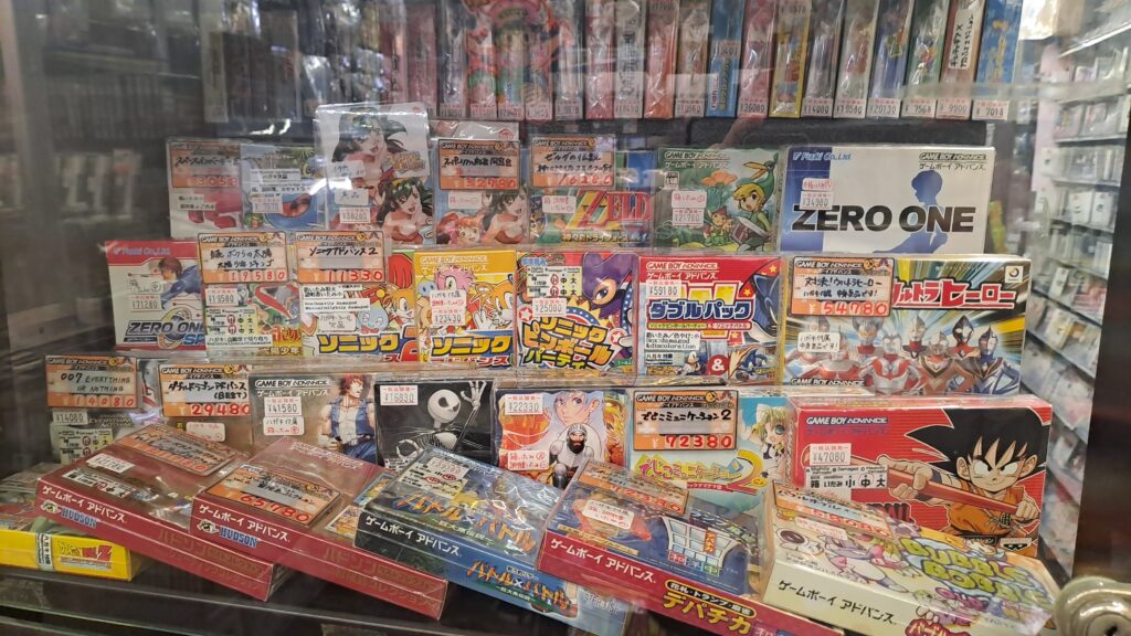 Rare Boxed GBA games behind a display in Super Potato, Den-Den Town